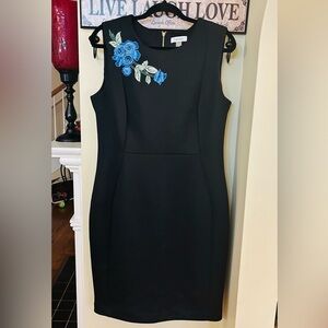 CALVIN KLEIN; size 14; black cocktail dress with blue florets on right lapel!